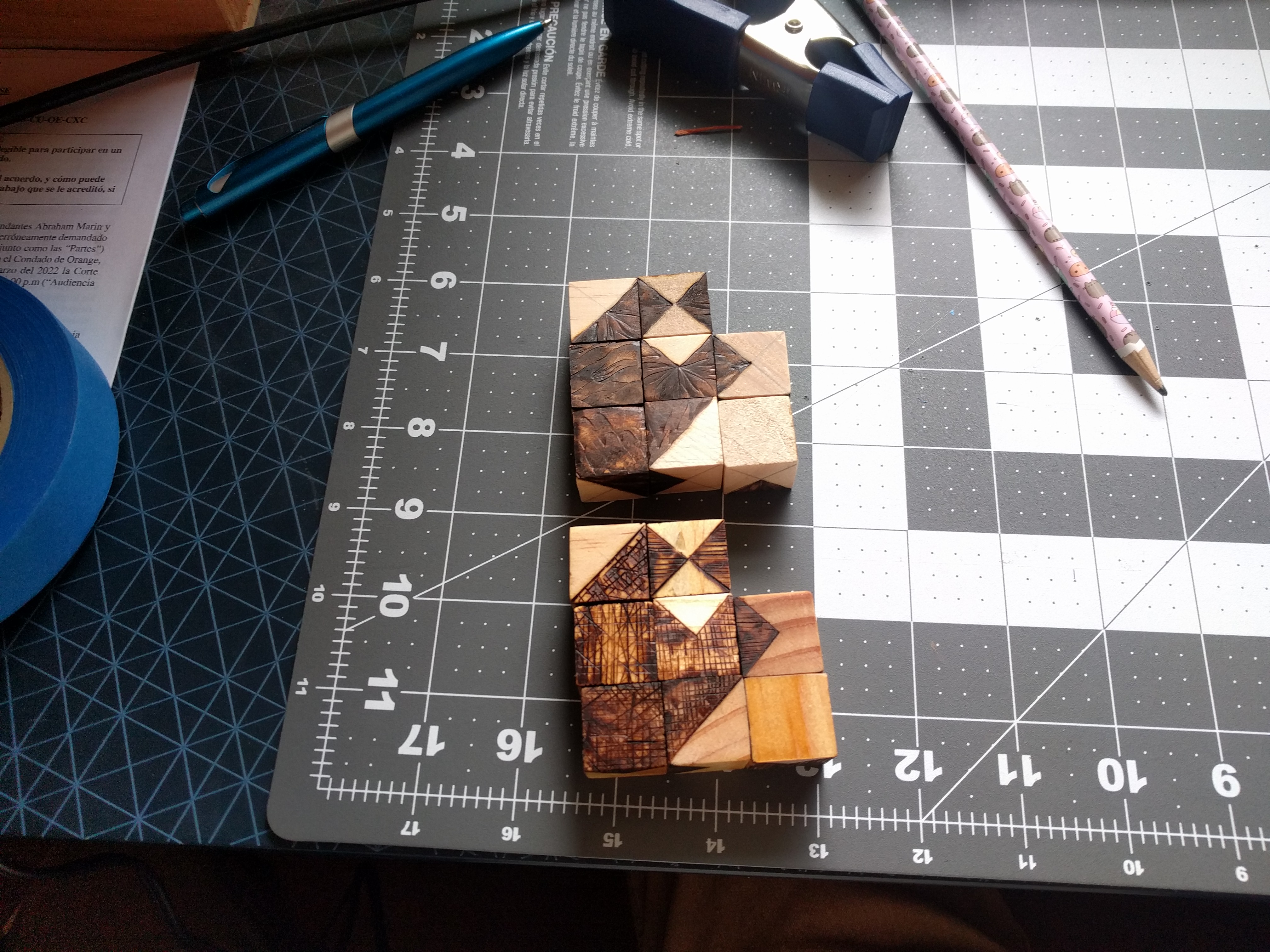 Two hako dice sets with different wood burning patterns